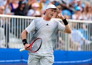Billy Harris clenching his fist in celebration at the Lexus Surbiton Trophy while wearing Adidas kit