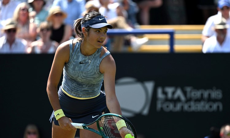 Emma Raducanu lines up a serve in action at Eastbourne