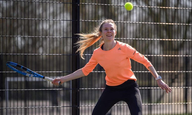 An amateur tennis player in action